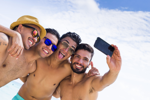 Group of men smiling in the sun
